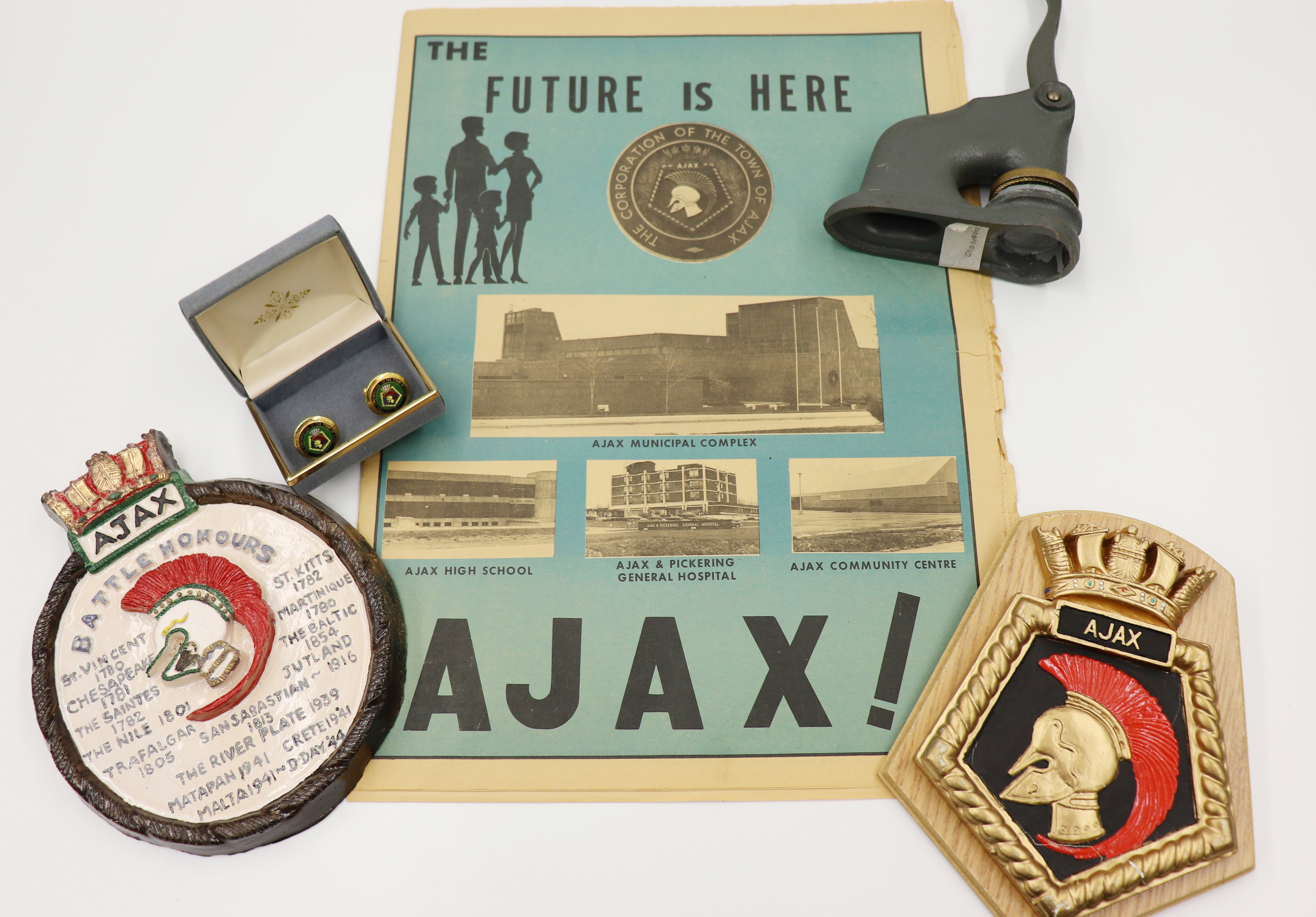 An image of items from Ajax Archives, including a Town of Ajax pamphlet and various Ajax seals.