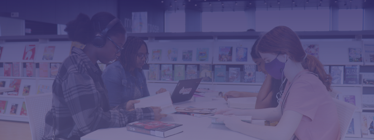 Teens studying at tables at Audley Branch.
