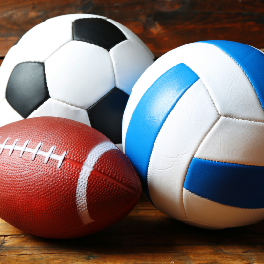 Soccer ball, volleyball, and football. 
