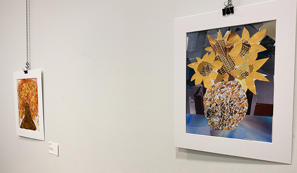 Two pieces of artwork on a wall in Rotary Room at Main Branch