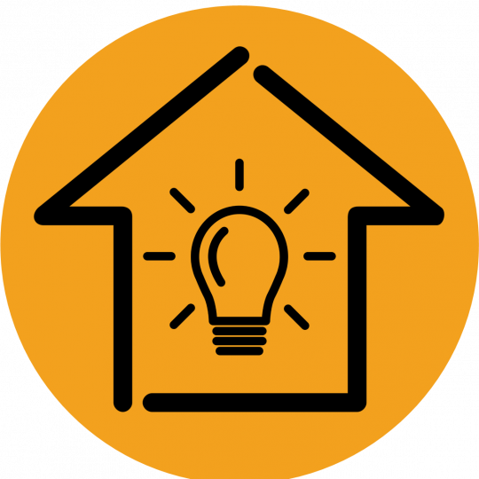 A yellow circle with a black outline of a house. Inside the house outline is a large lightbulb.