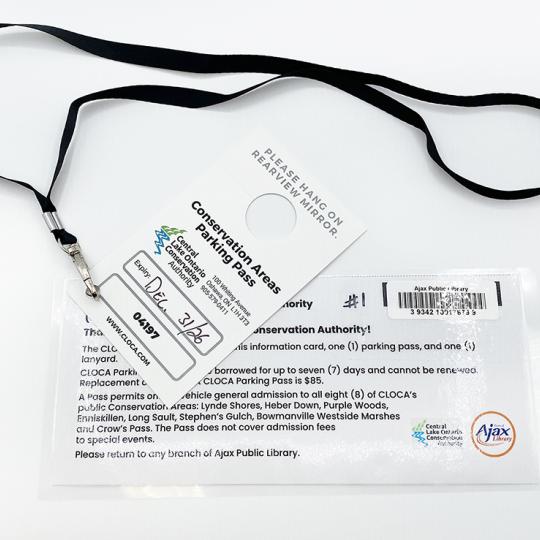 A laminated pass on a black lanyard.